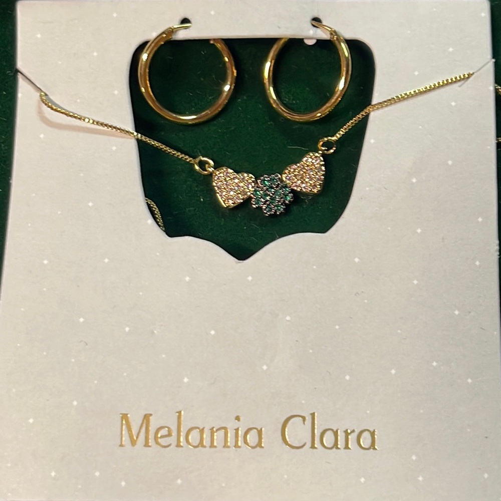 Melania Clara Oracle Sun necklace shamrock hearts necklace and earrings